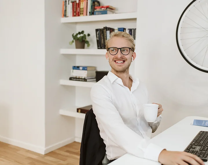 A man smiling looking into the camera